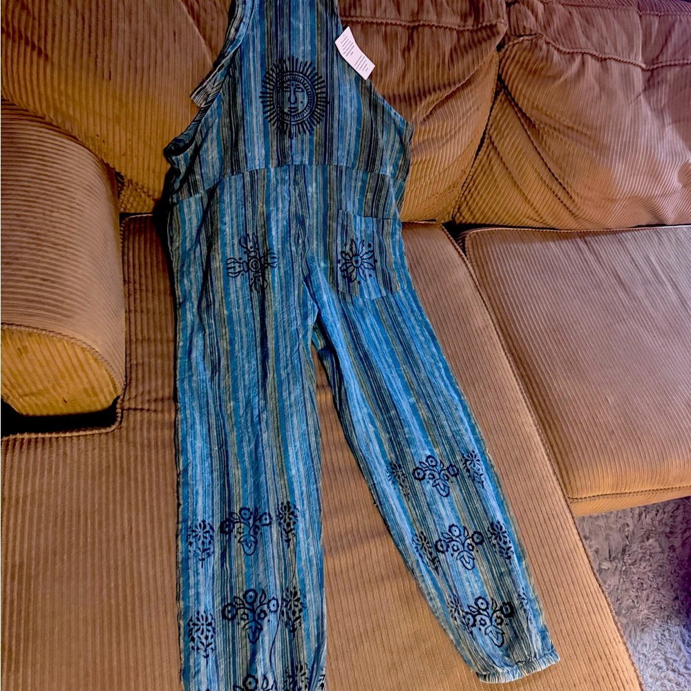 Blue overalls with black detail.  Size medium- new with tags!